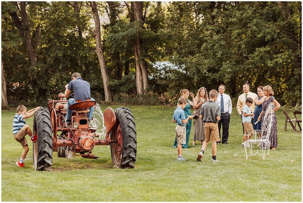 Guests enjoying the Lyons Farmette and the vintage tractor